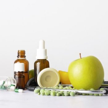 close-up-bottles-with-oil-pills-table_23-2148431495