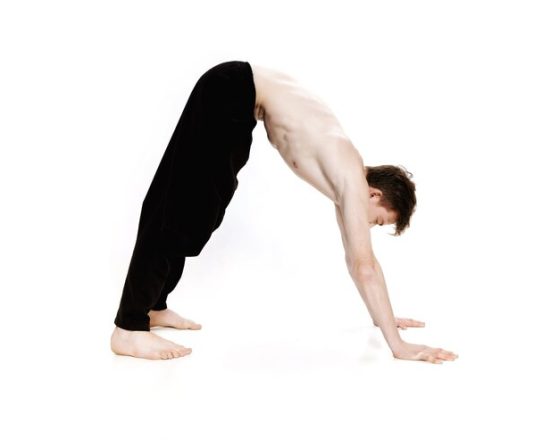young-man-doing-yoga-exercises-studio-shot-white-background_114963-8802